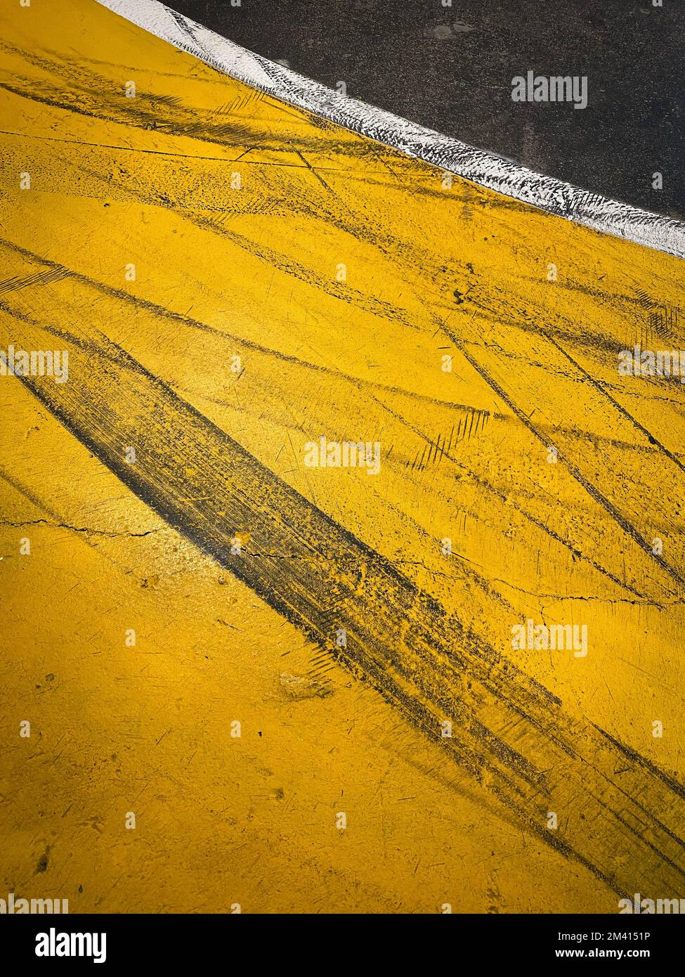Tire marks on road. Race track. Yellow and black asphalt Stock Photo