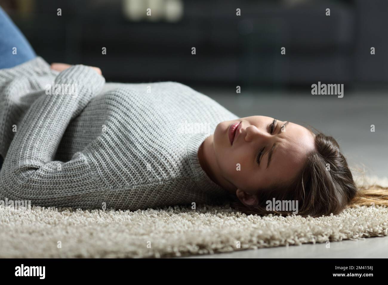 Depressed girl lying on floor hires stock photography and images Alamy