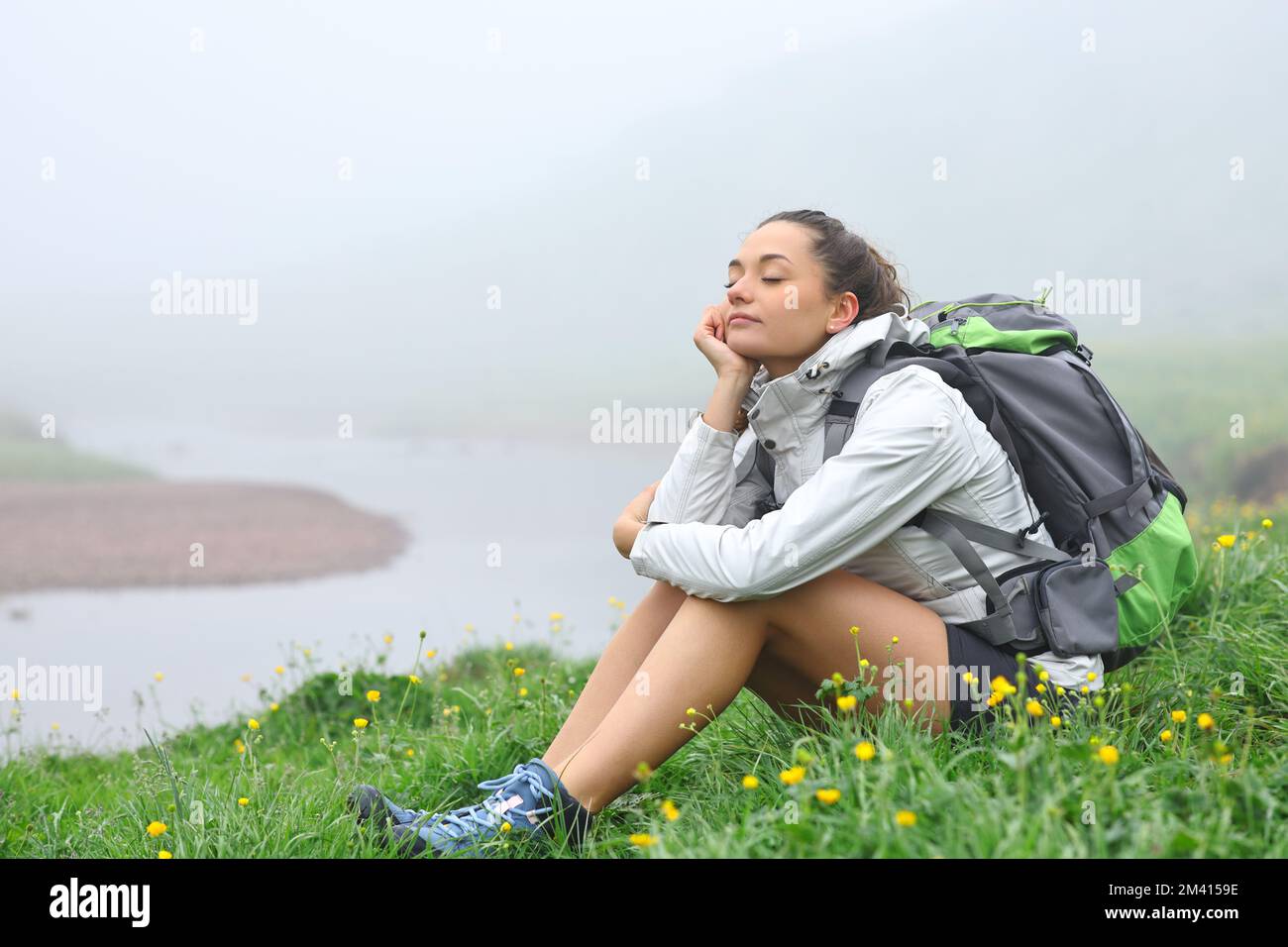 Happy female hiker resting hi-res stock photography and images - Alamy