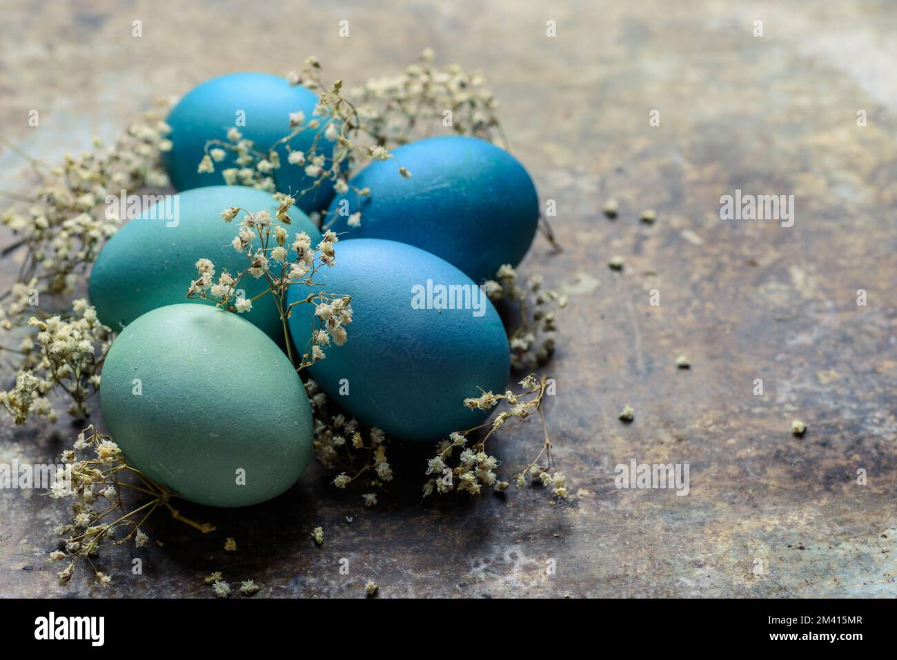 Happy Easter rustic concept. DIY dyed various shades of blue Easter ...