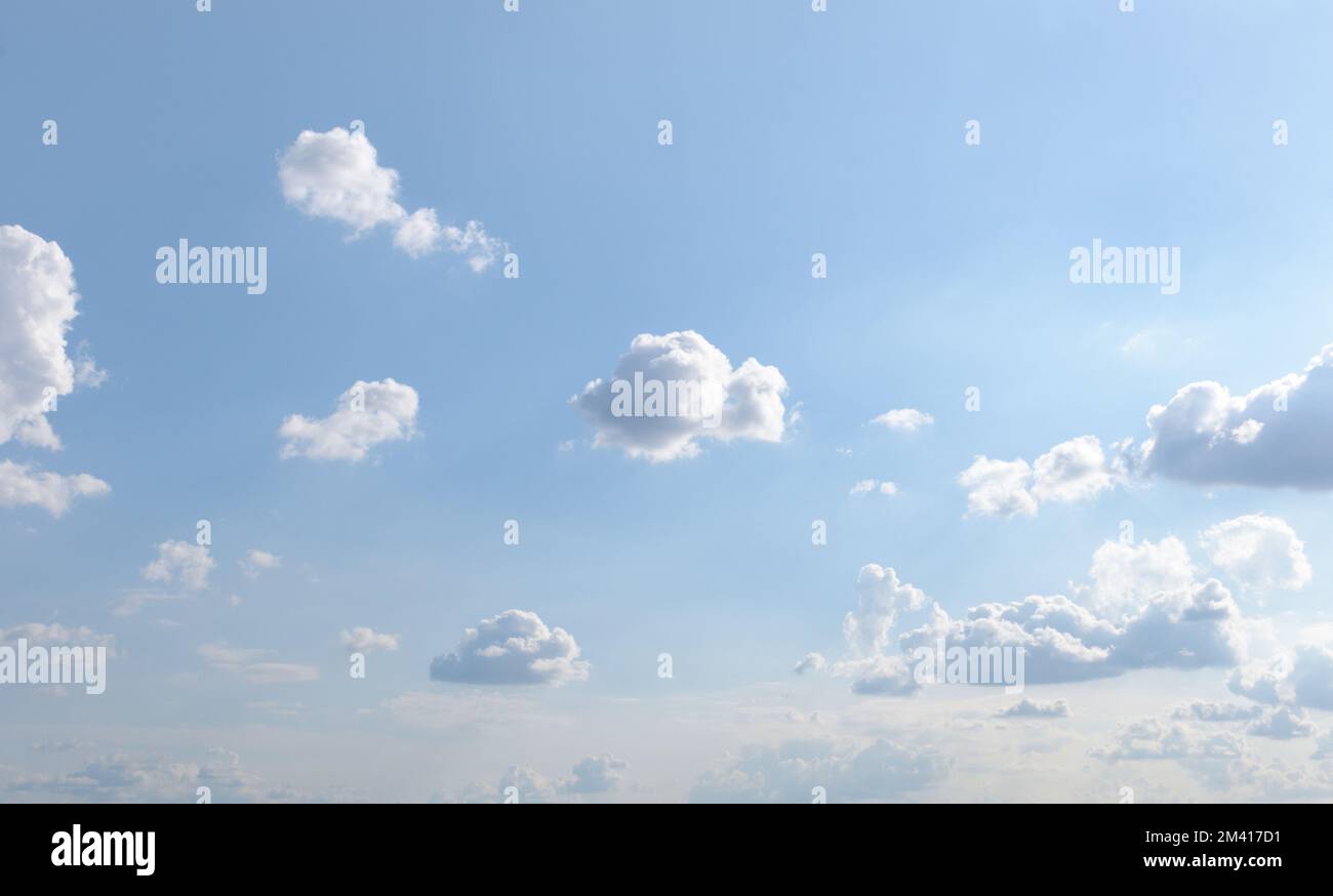 Blue summer sky with small fluffy clouds Stock Photo - Alamy
