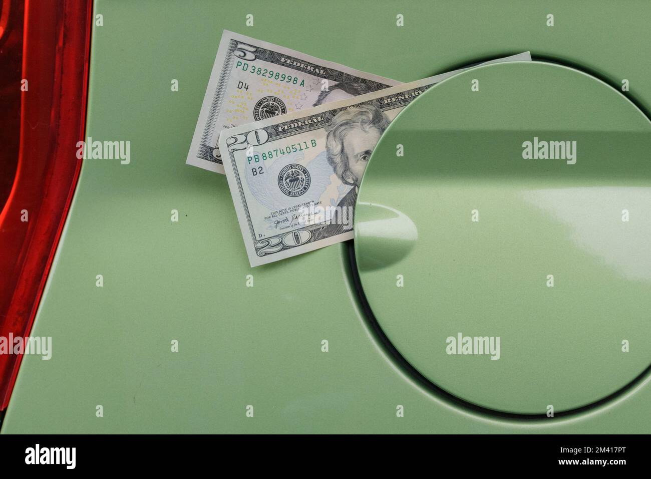 Dollar banknotes and car gas tank. Fuel price rise Stock Photo Alamy
