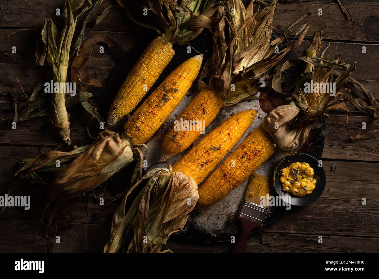roasted corn with husks Stock Photo Alamy