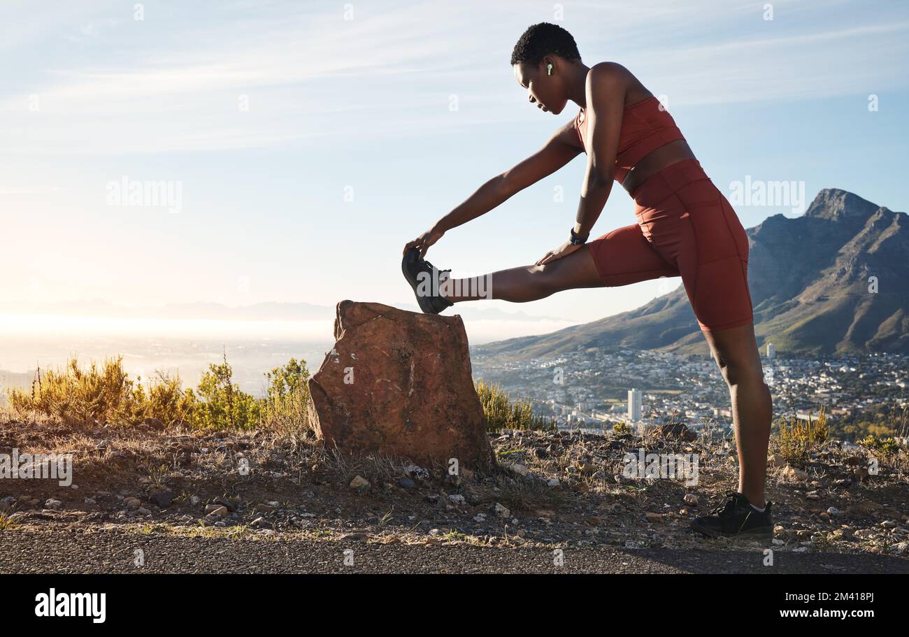 Stretching legs fitness and black woman on the mountain for training start hiking and workout motivation in Morocco. Music warm up and African Stock Photo Alamy