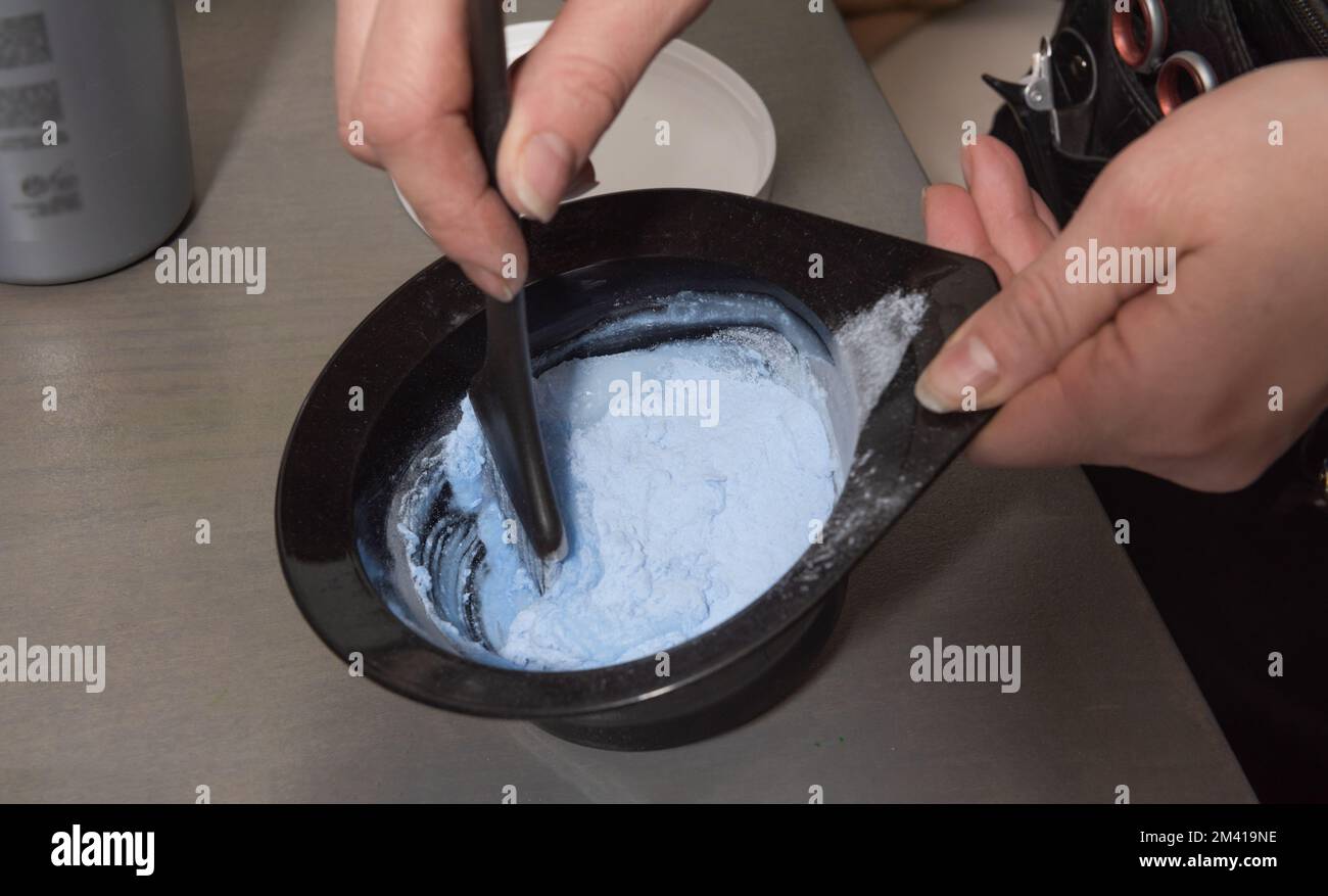 Paint mixing process. For dyeing the hair. Closeup Stock Photo Alamy