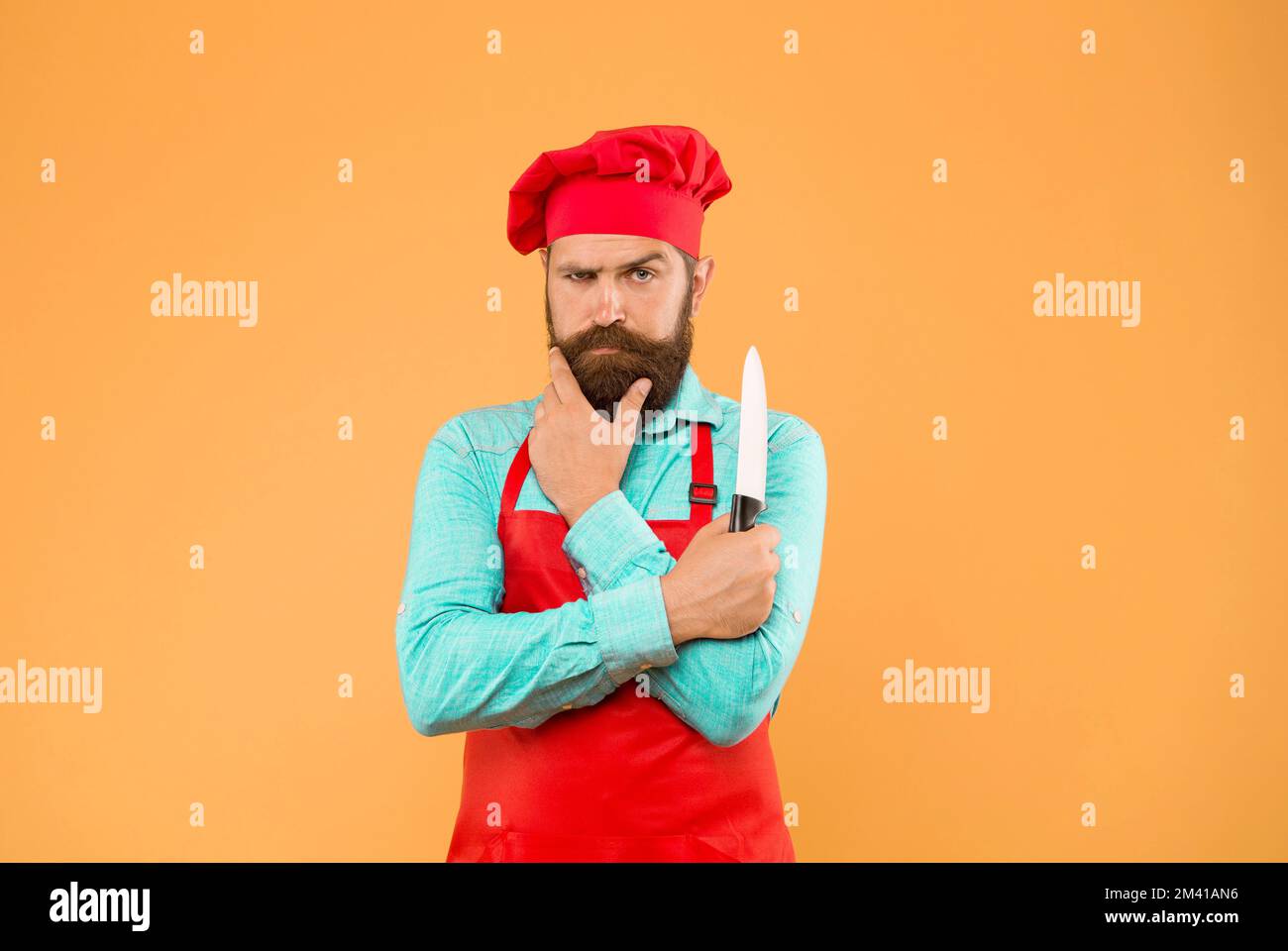 Excellent Cook Catering for all. Professional chef man with knife. excellent cook or ...