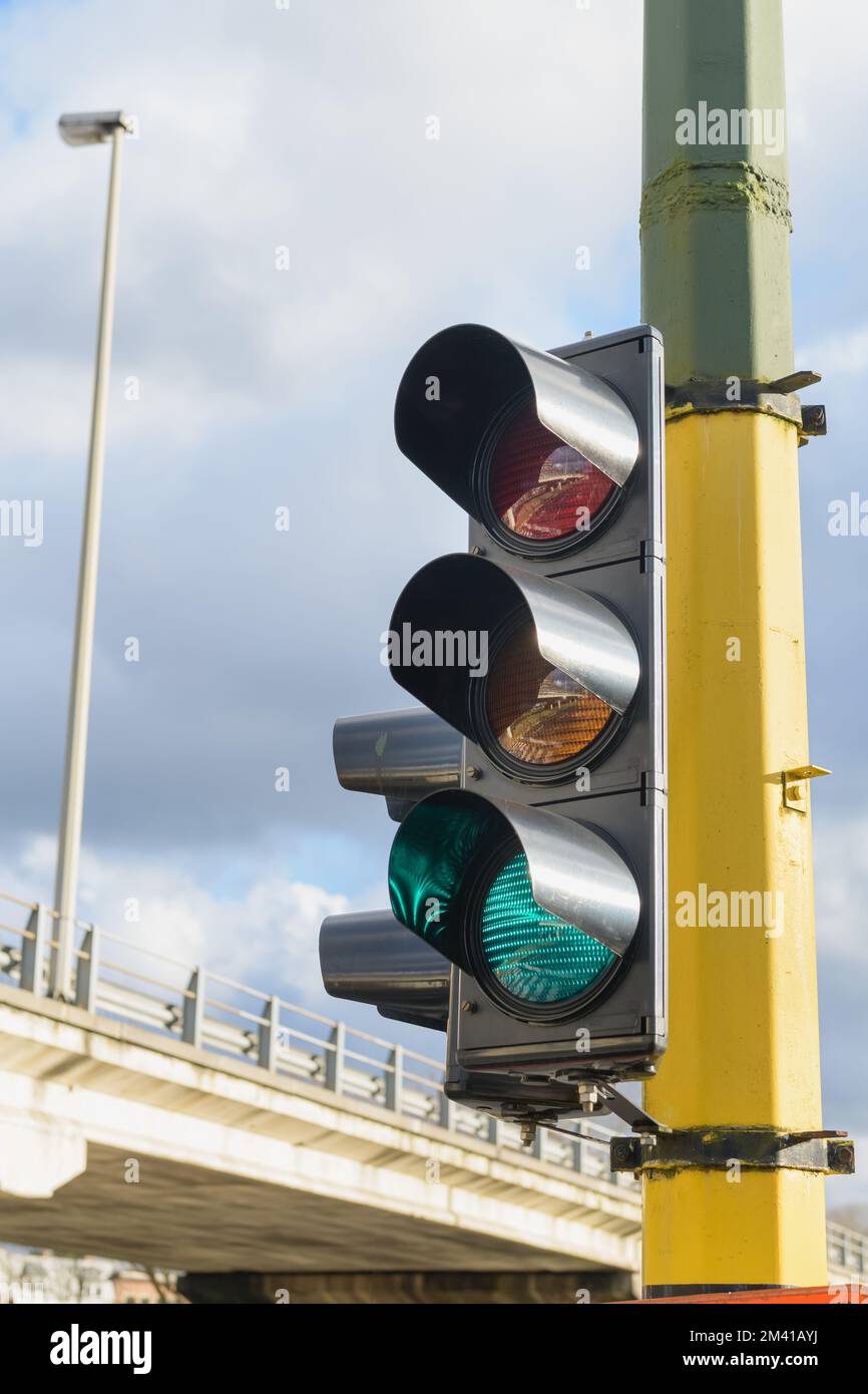 Сity traffic with traffic lights, in the foreground a traffic light with a green light Stock Photo