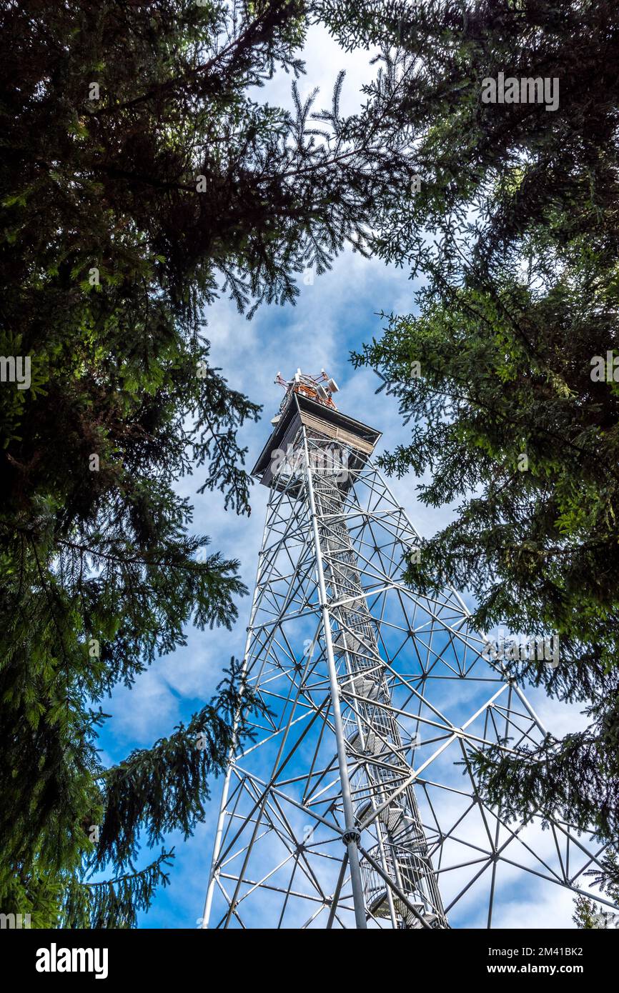 Look to transmitter telecommunication tower from the ground. GSM and television signal, touristic lookout tower Stock Photo