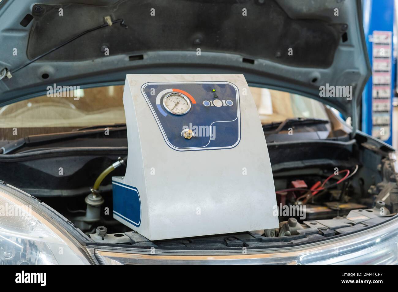 Automated change of brake fluid in a car service. Car Stock