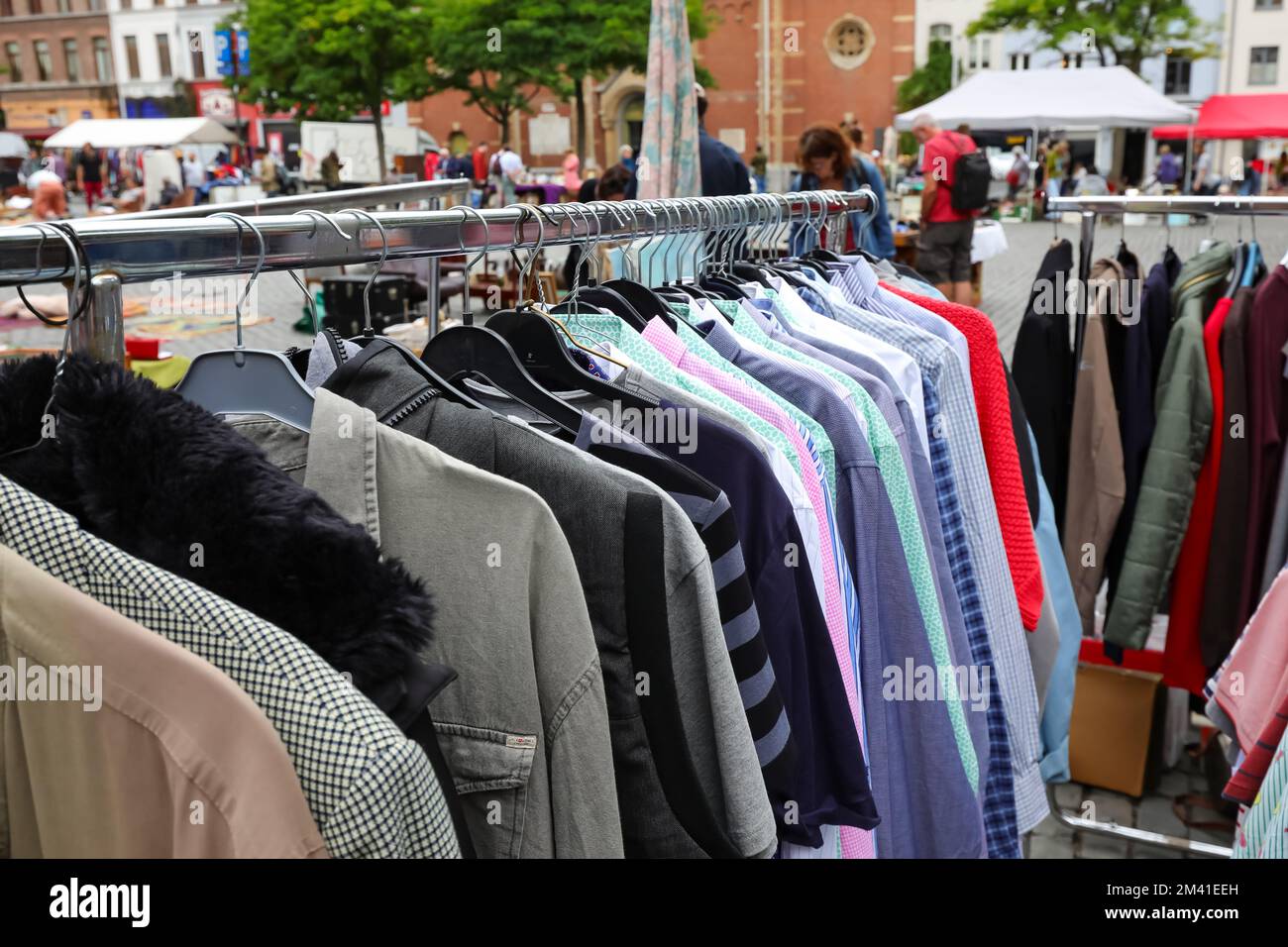many used vintage clothes for sale at stand of alfresco flea market