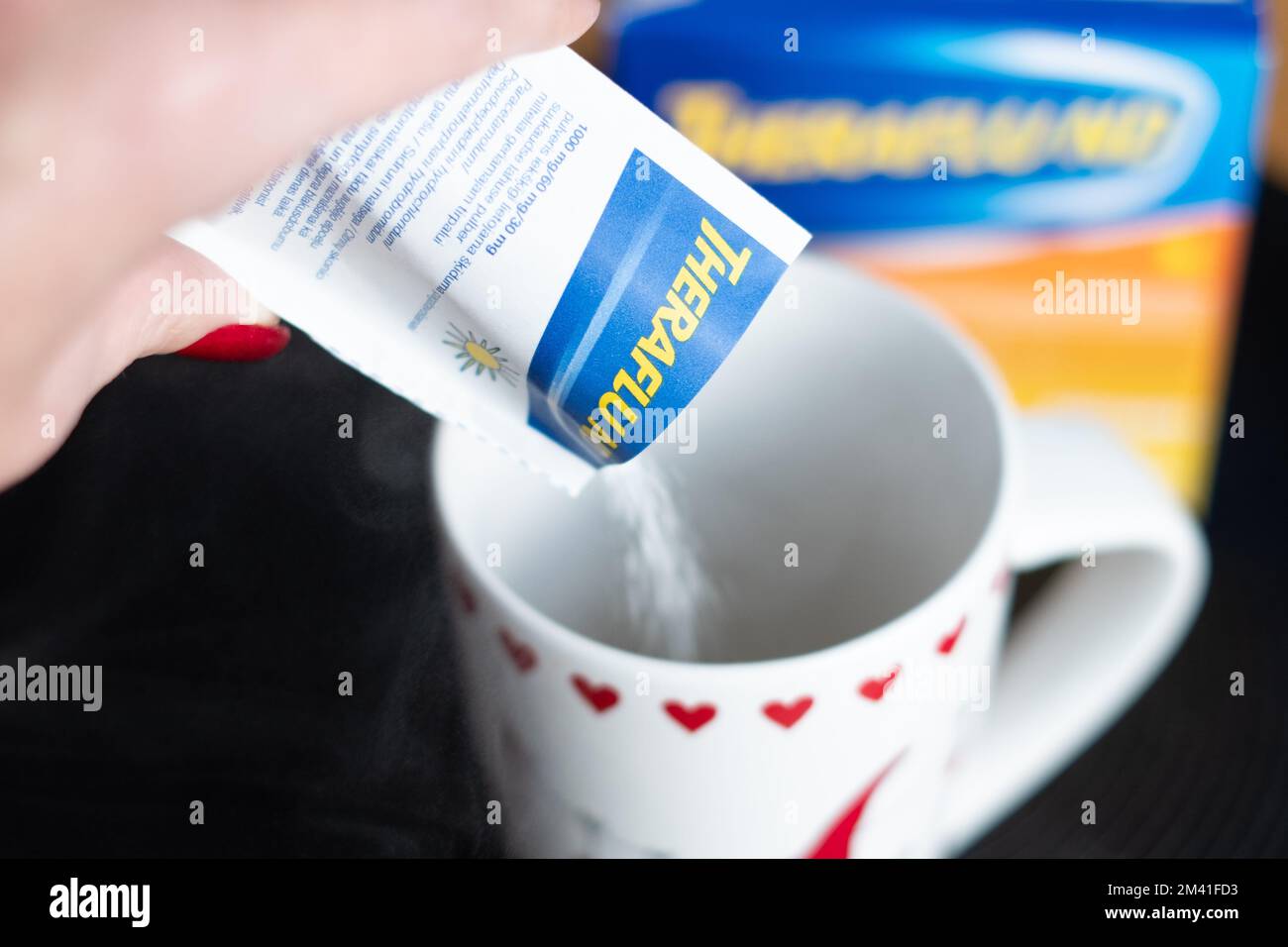 Tallinn, Estonia - December 16, 2022: Theraflu tea powder for flu treatment. Stock Photo