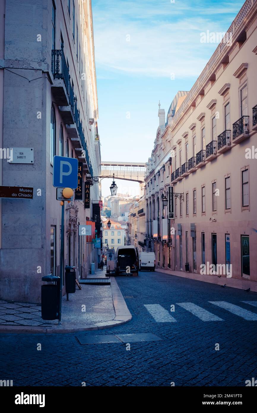 A vertical shot of the narrow street between the buildings in Lisbon ...