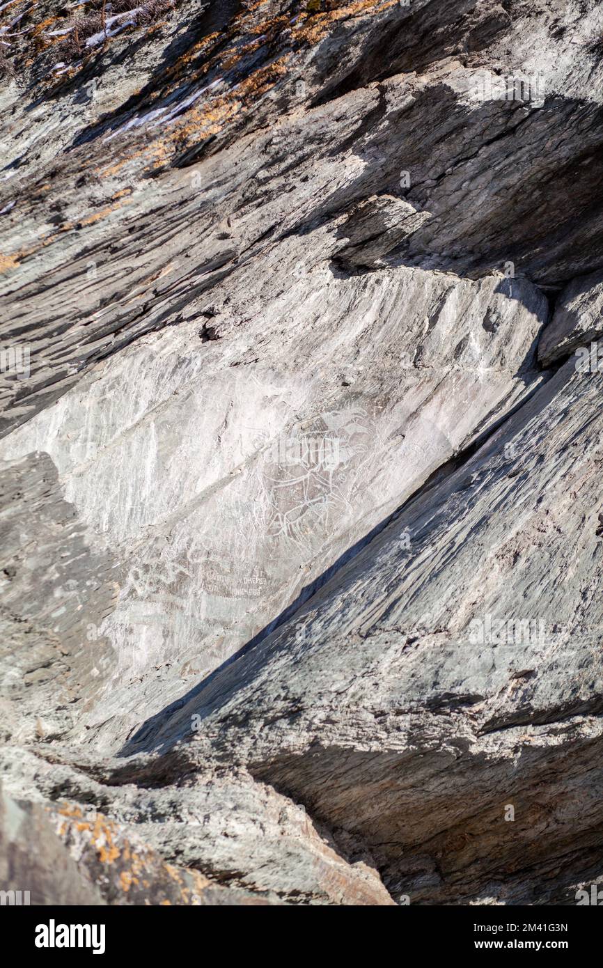 Old rock carvings of an ancient man on rocks in Siberia Stock Photo - Alamy