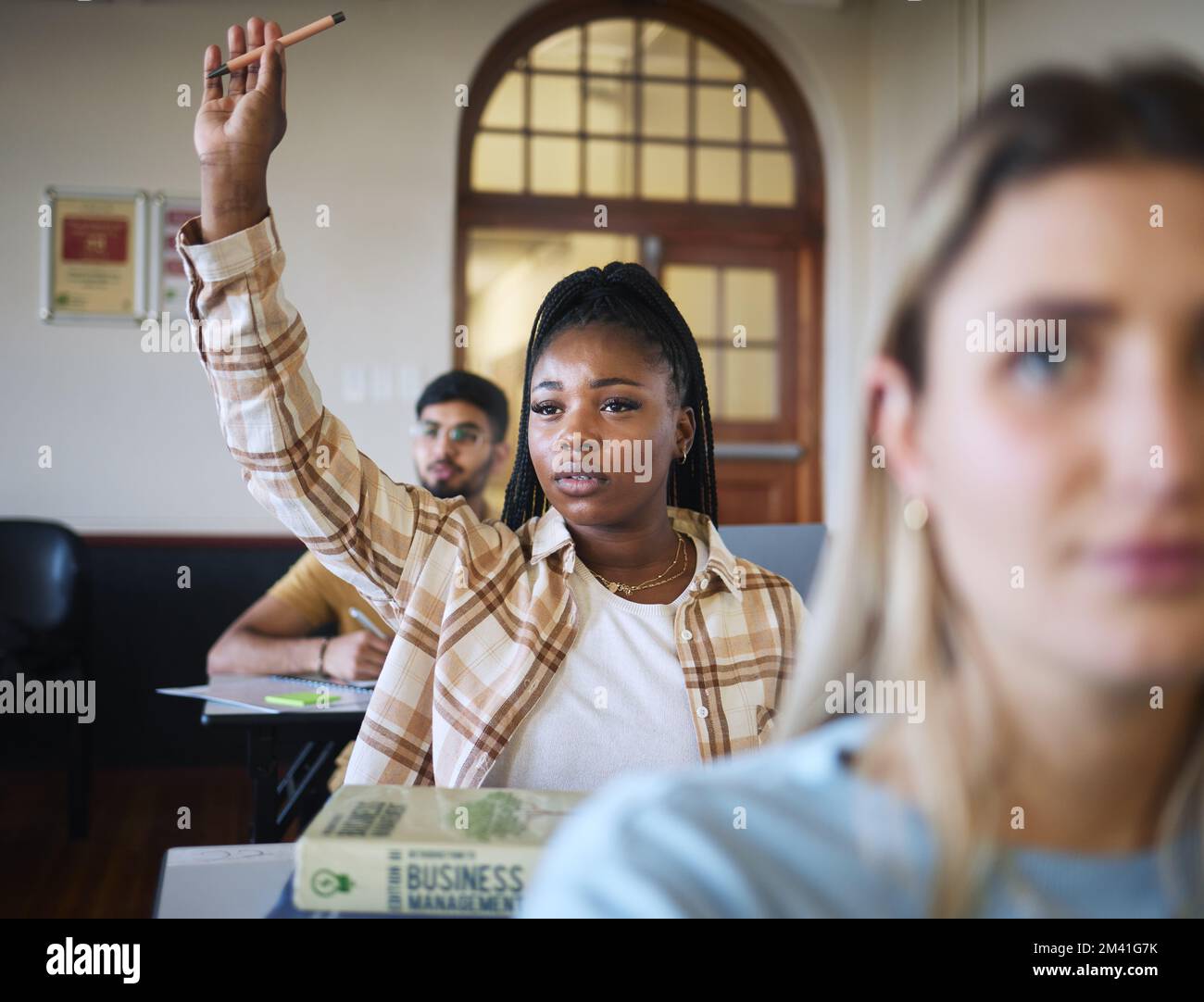 Question, black woman and student in a business management class ready for learning. Questions, education and university seminar of a woman in a Stock Photo
