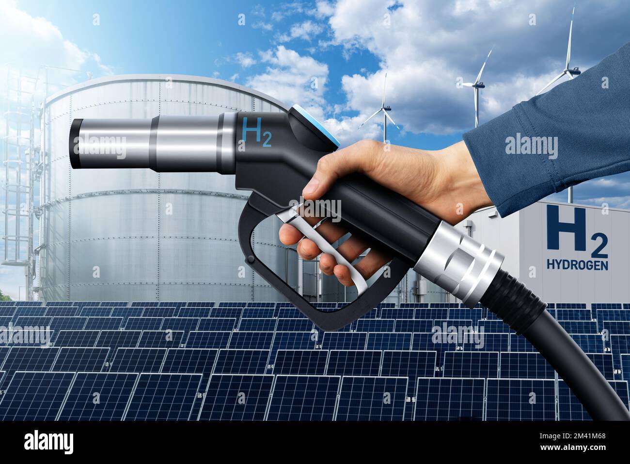 Hand with hydrogen fueling nozzle on a background of H2 factory. Hydrogen production from renewable energy sources concept Stock Photo