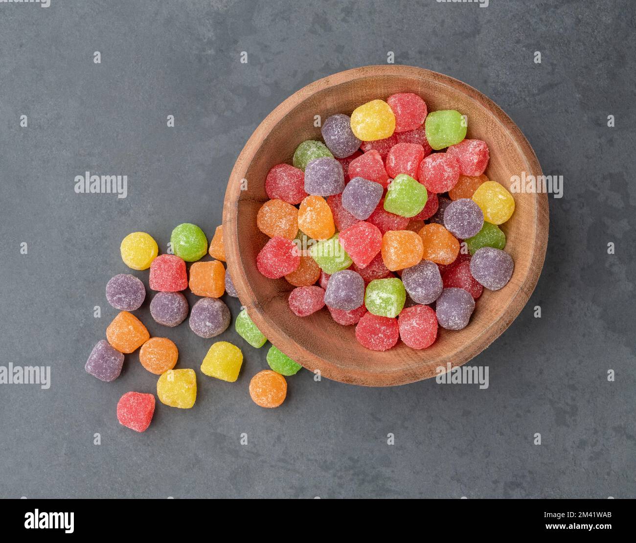 Colorful gum drop candies over stone background Stock Photo - Alamy