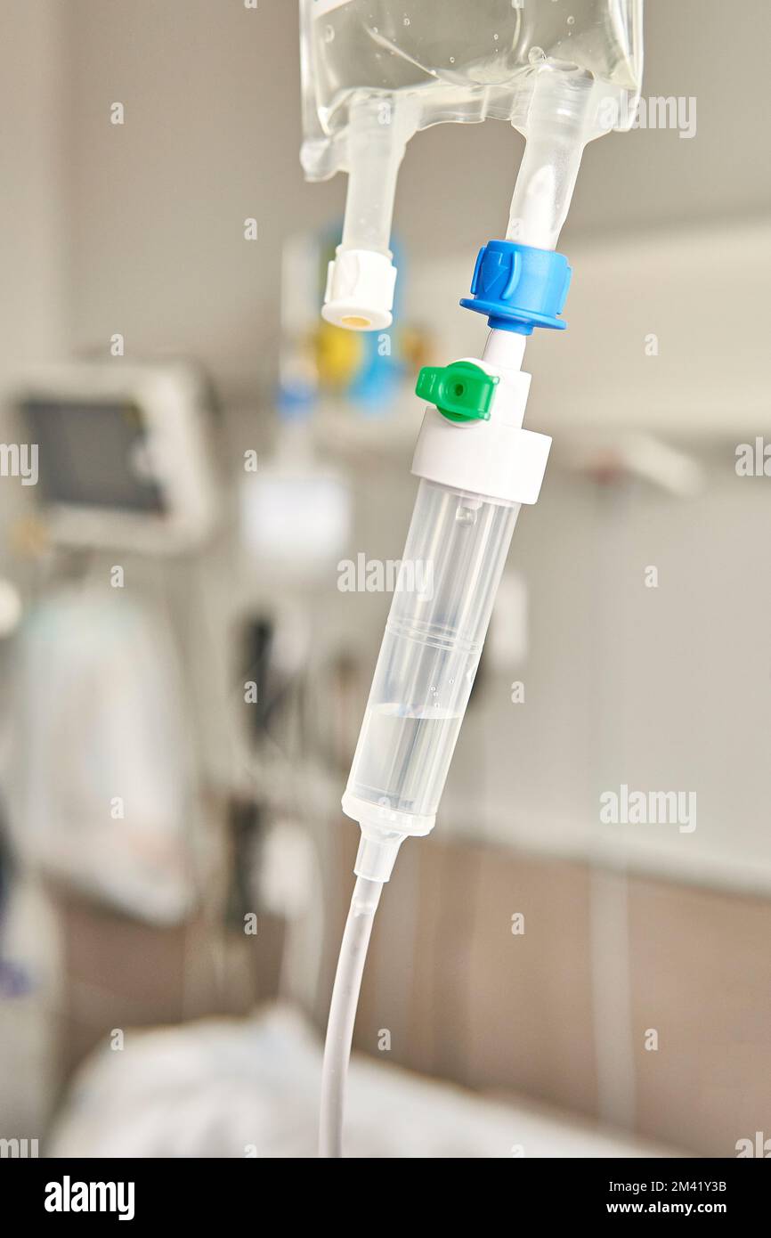 hospital drip. Hospital medication dosing equipment with medical equipment background Stock Photo