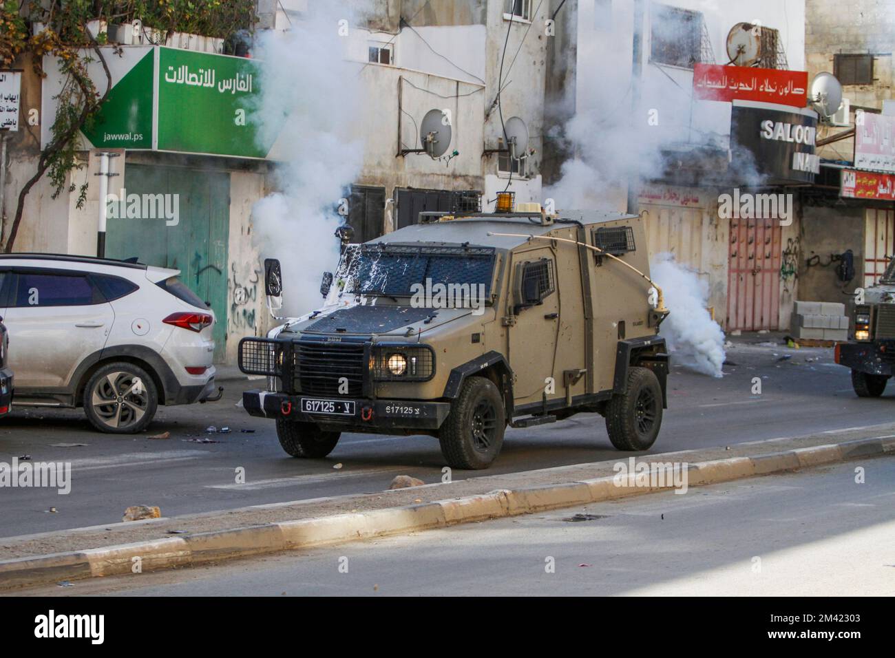 Nablus, Palestine. 18th Dec, 2022. Israeli army forces fire tear gas ...