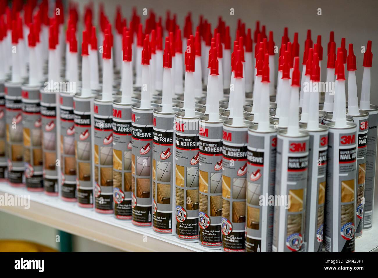 Tubes of grout sealer in a hardware store. Stock Photo