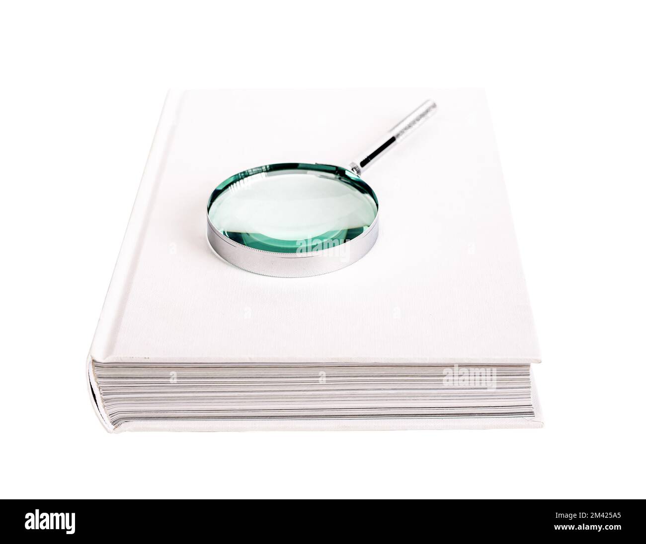 Book with magnifier, lens, glass, loupe on paper book in hardback isolated on white background. High quality photo Stock Photo
