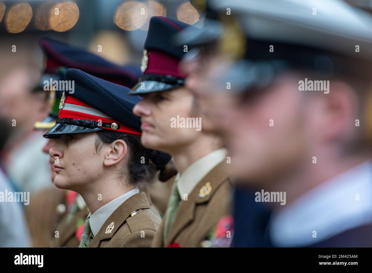 A woman represents the armed forces at a service of remembrance in Chelsea Stock Photo