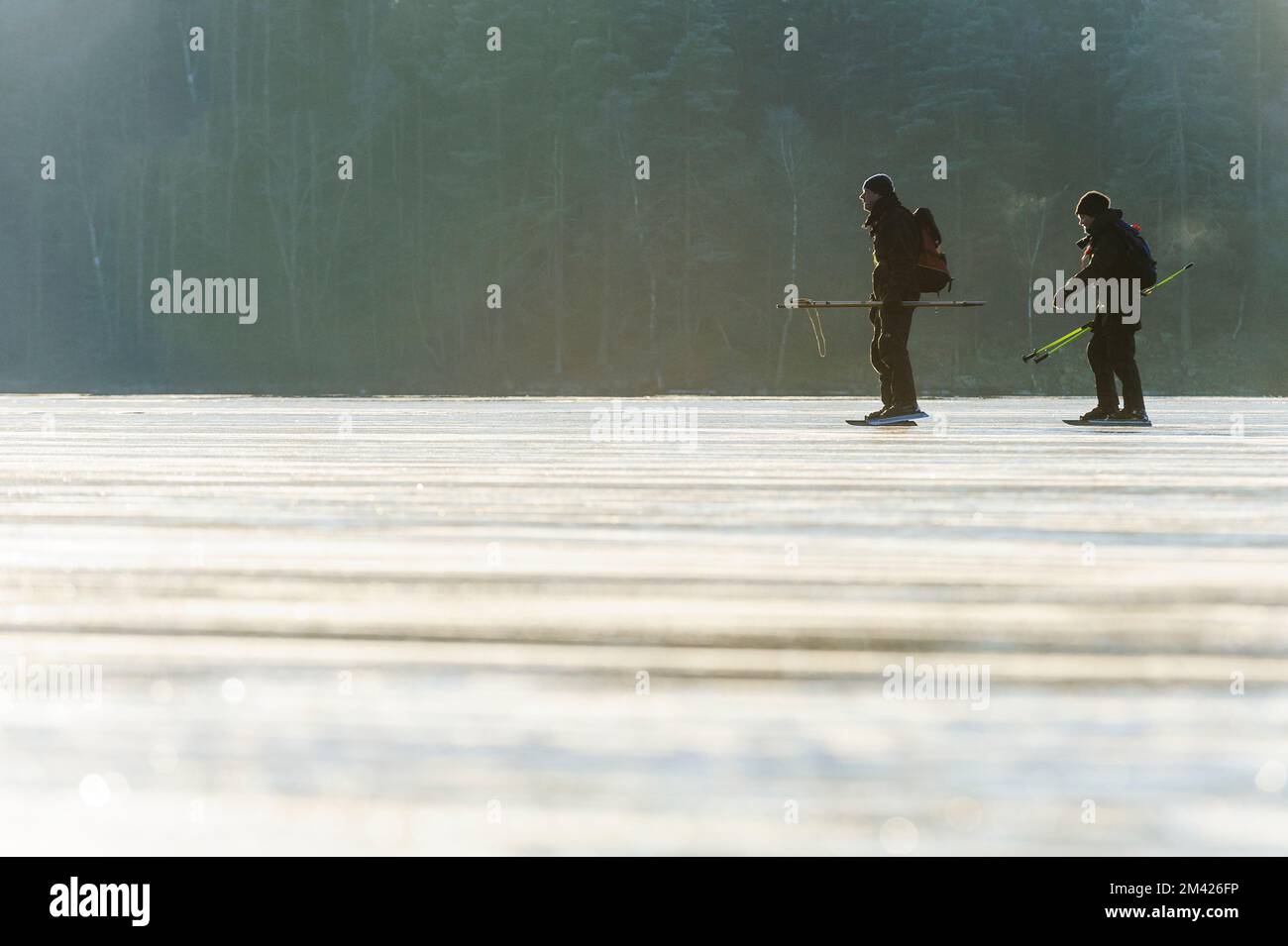 Skating on a frozen lake Stock Photo - Alamy