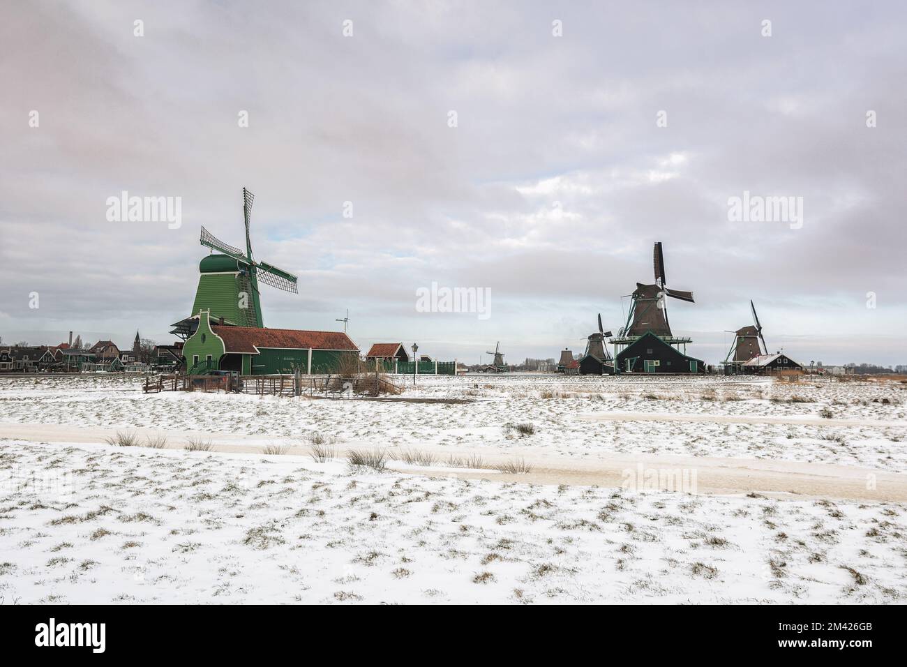 Zaandam, Netherlands, February 10, 2021:View of traditional Dutch windmills in the small village of Zaanse Schans in Zaandam, Netherlands. Stock Photo
