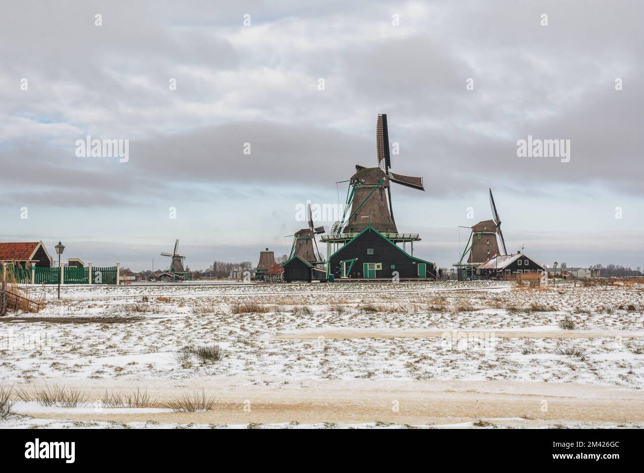 Zaandam, Netherlands, February 10, 2021:View of traditional Dutch windmills in the small village of Zaanse Schans in Zaandam, Netherlands. Stock Photo