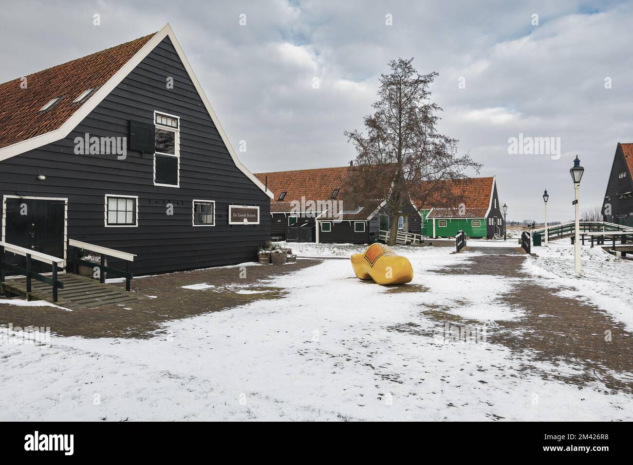 Zaandam, Netherlands, February 10, 2021: The symbol of the Netherlands is a klomp against the backdrop of a winter landscape. Stock Photo