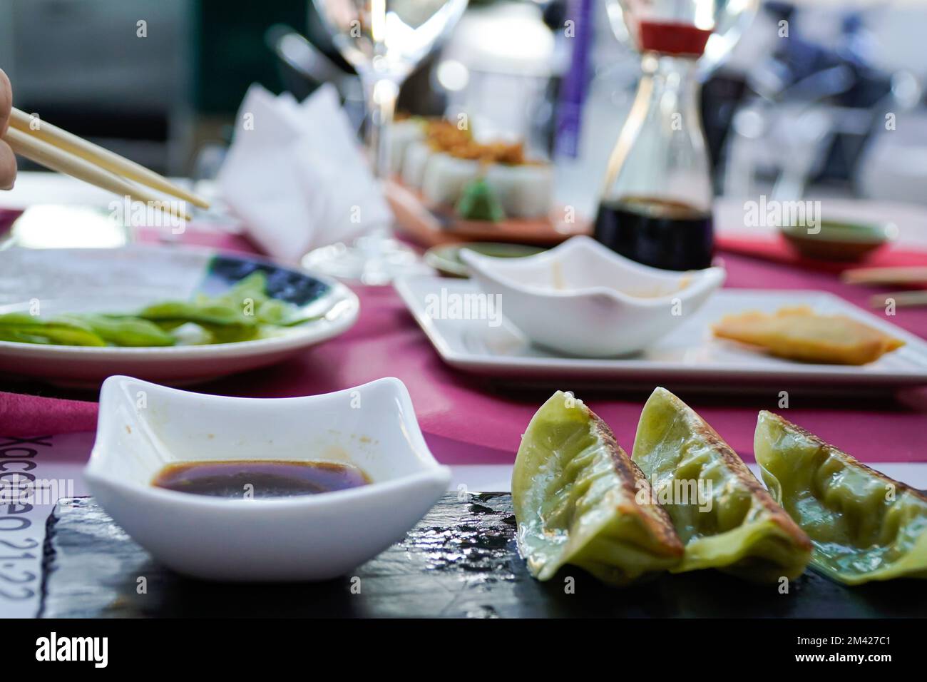 mixed chinese food on top of the table of a chinese restaurant Stock