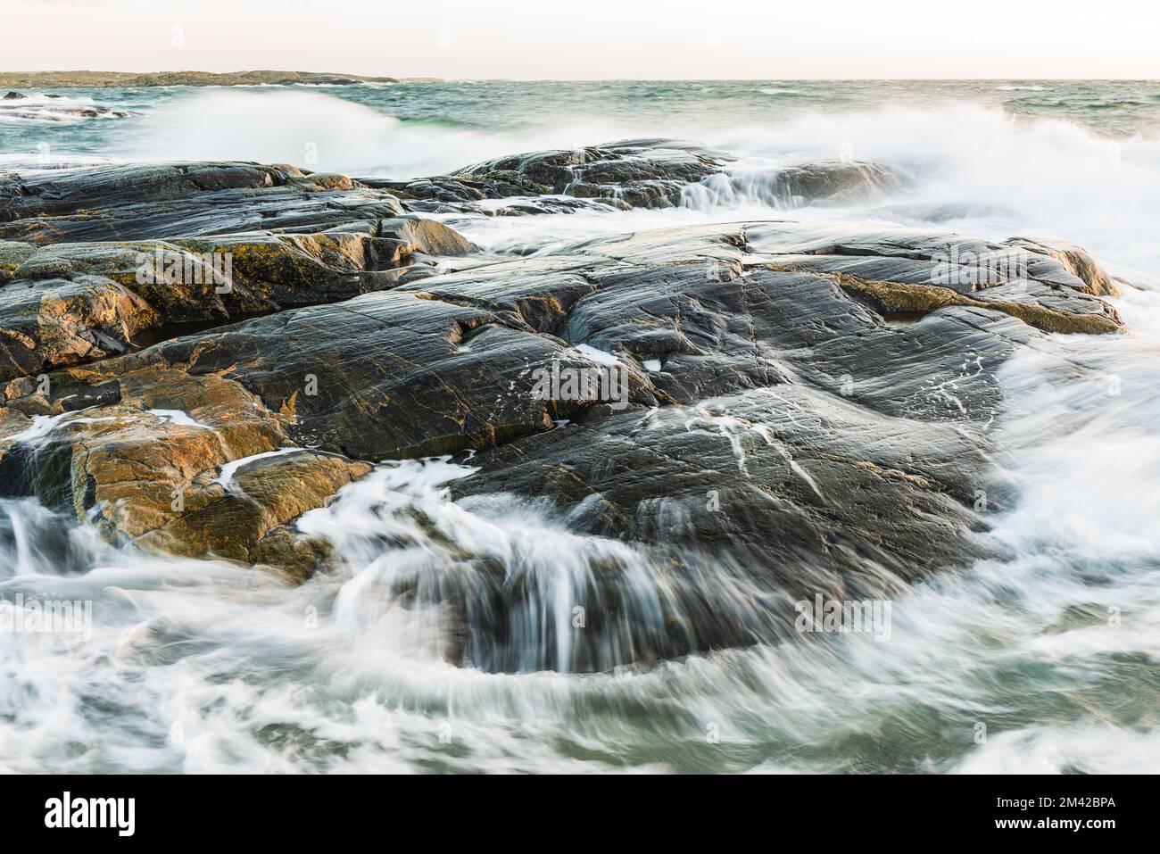 Waves crashing on rocks a stormy day, Sweden. Stock Photo