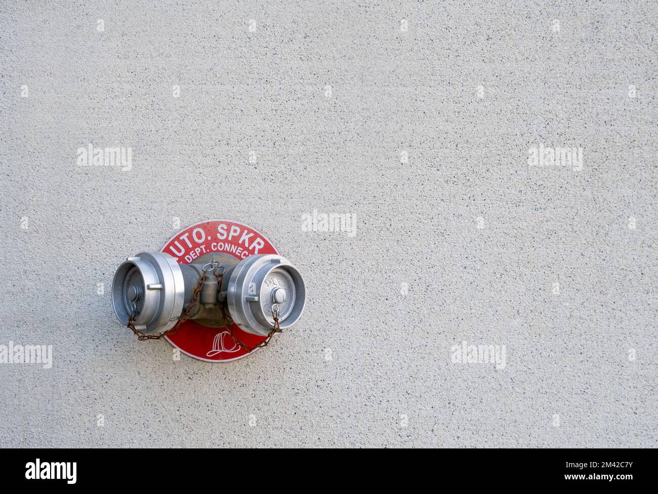 Standpipe on wall. Fire water outlet. Fire hydrant on the wall Stock Photo