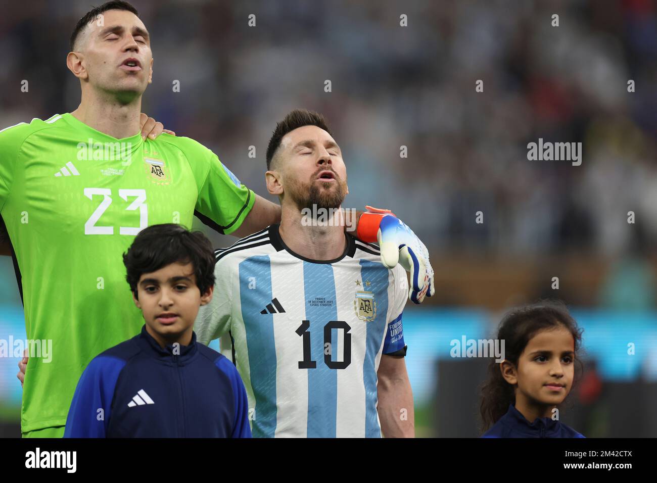 Lusail, Qatar. 18th Dec, 2022. Lionel Messi (2nd R) and Emiliano Martinez (1st L) of Argentina sing national anthem prior to the Final between Argentina and France at the 2022 FIFA World Cup at Lusail Stadium in Lusail, Qatar, Dec. 18, 2022. Credit: Cao Can/Xinhua/Alamy Live News Credit: Xinhua/Alamy Live News/Alamy Live News Stock Photo