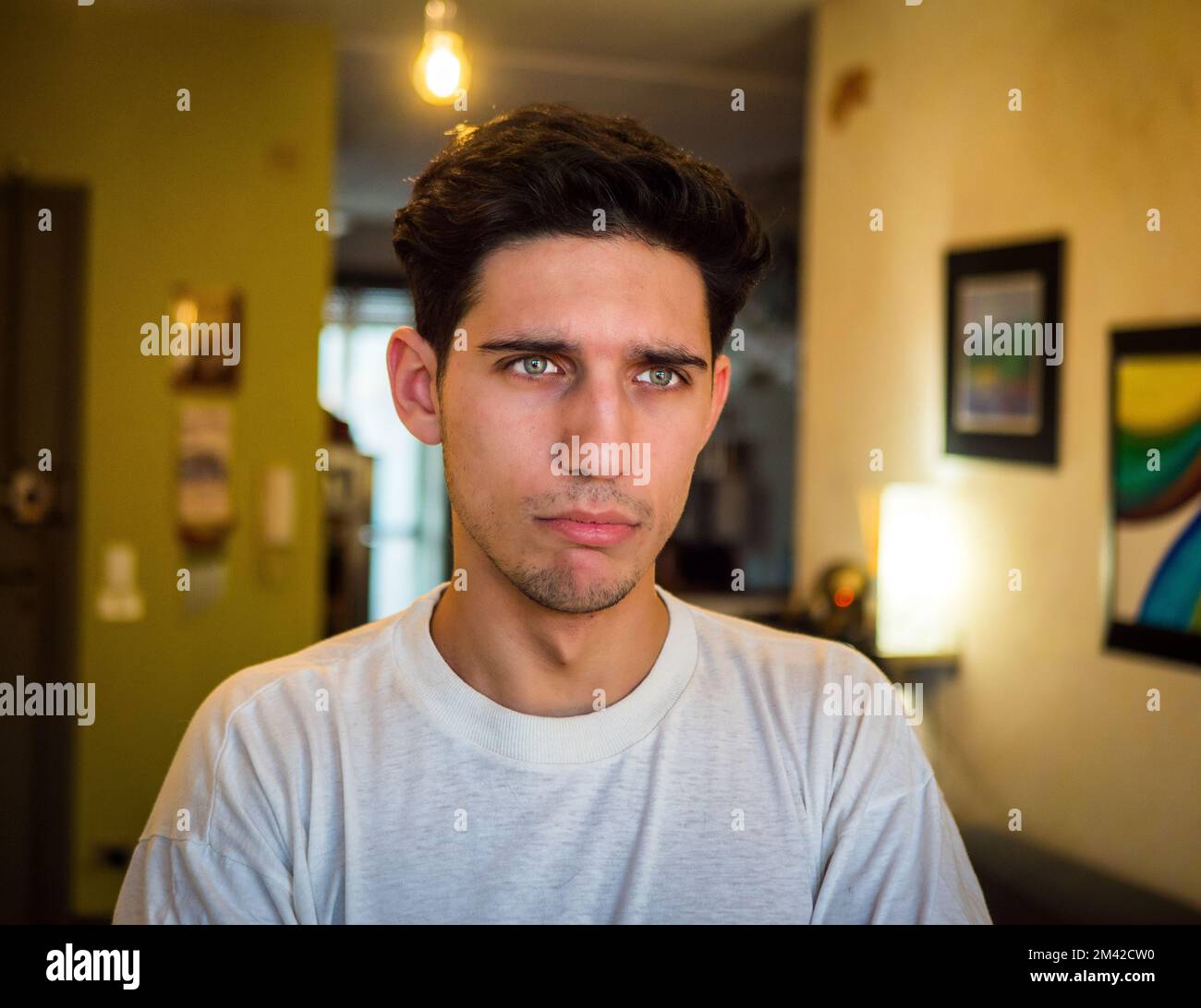 Pensive Handsome Young Man with Sad Face Stock Photo