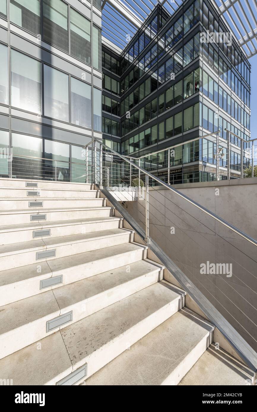 Image of a metal and glass facade with metal frames, railing with steel ...