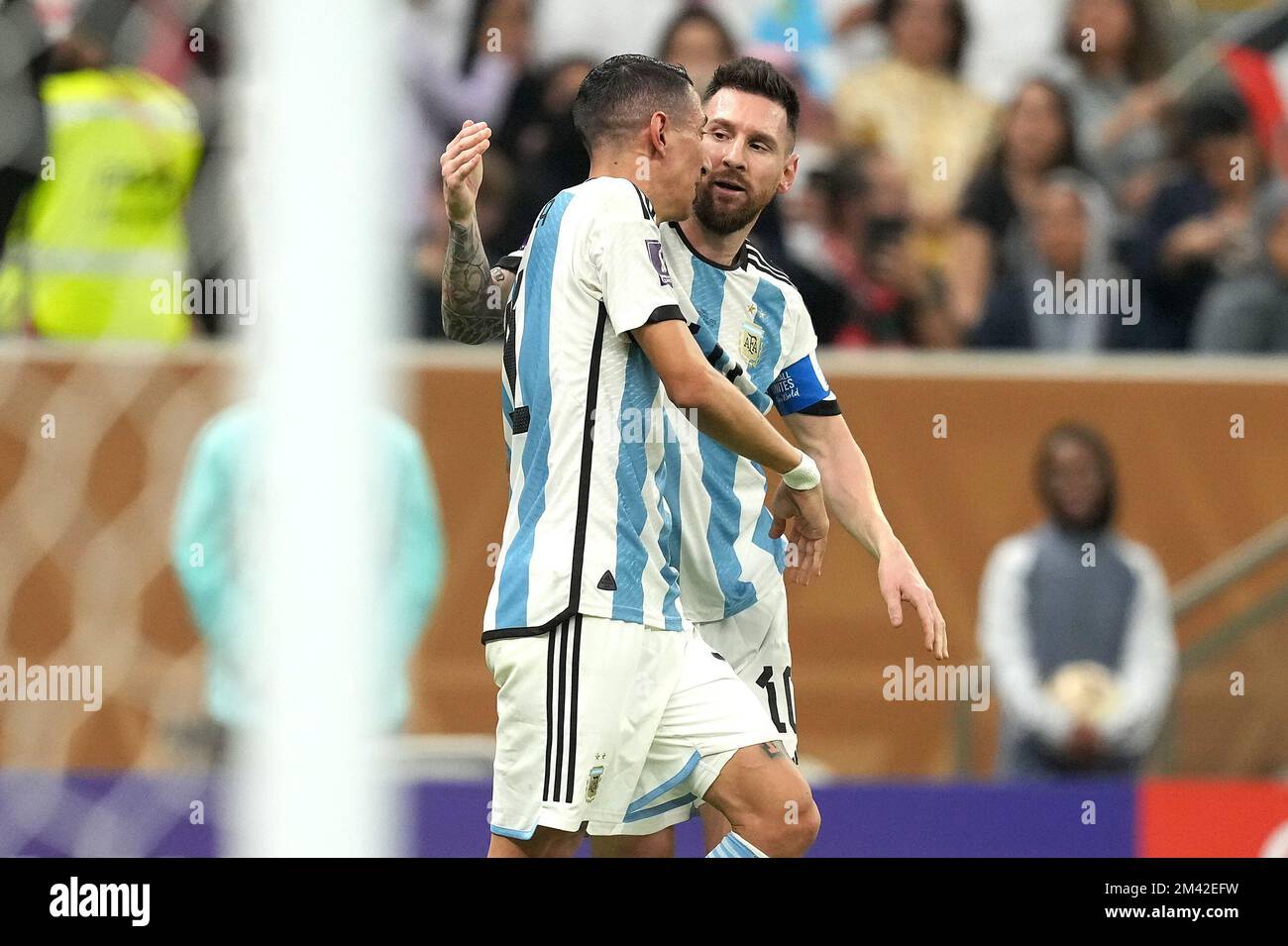 Argentina's Lionel Messi (right) celebrates scoring their side's first goal of the game from the penalty spot with team-mate Angel Di Maria during the FIFA World Cup final at Lusail Stadium, Qatar. Picture date: Sunday December 18, 2022. Stock Photo