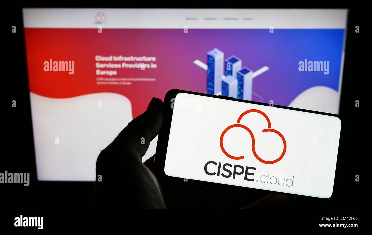 Person holding smartphone with logo of cloud providers trade association CISPE on screen in front of website. Focus on phone display. Stock Photo
