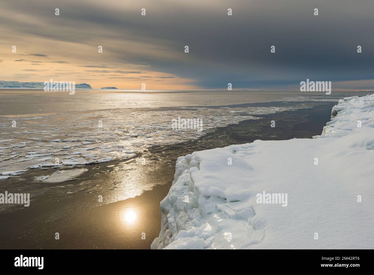 Sun shining on icy sea, Greenland. Stock Photo