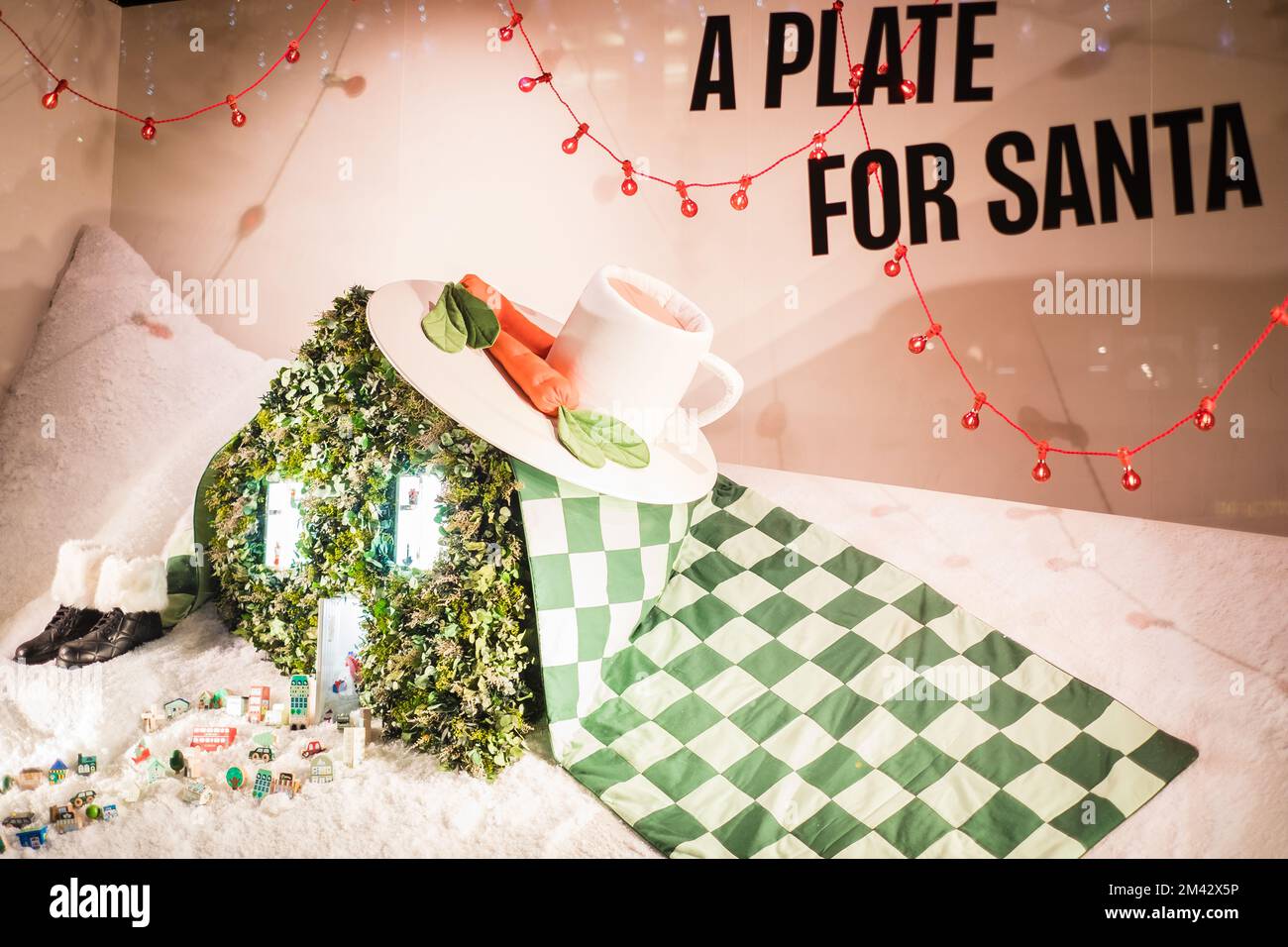 London, UK - November 6, 2022: 'A plate for Santa' Christmas shopping window design of Selfridges department store on Oxford Street, London. Stock Photo