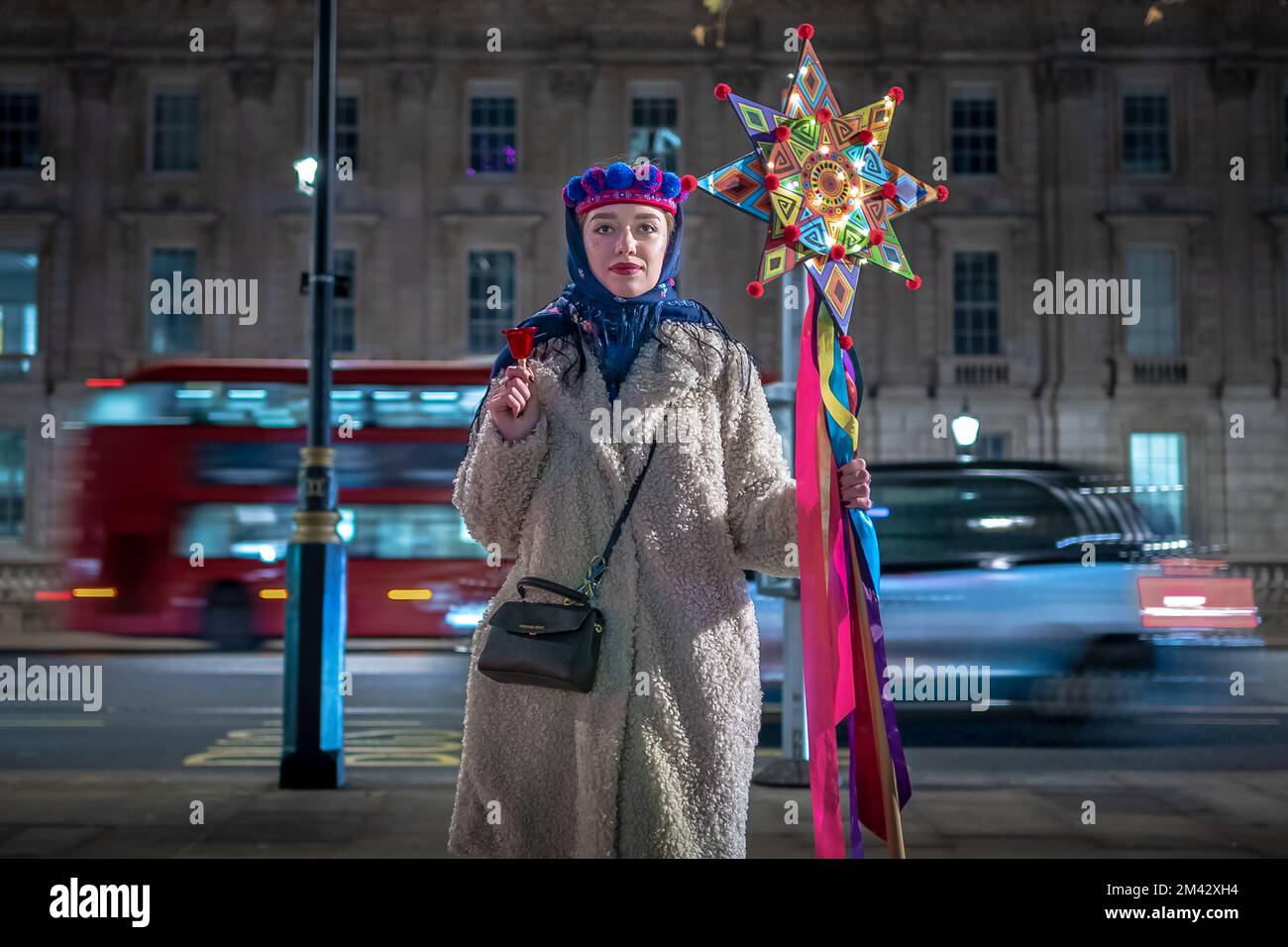 London, UK. 17th December 2022. British-Ukrainian protesters stage a Vertep theatre performance near Downing Street. In Ukrainian culture, Vertep is a travelling theatre and drama presenting festive folk stories, nativity scenes and other mystery plays. Traditionally young children dress as the various characters and act out the plays of the Vertep. Credit: Guy Corbishley/Alamy Live News Stock Photo