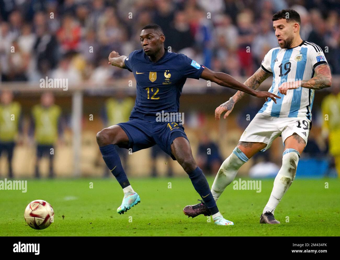 France's Randal Kolo Muani (left) and Argentina's Nicolas Otamendi battle for the ball during the FIFA World Cup final at Lusail Stadium, Qatar. Picture date: Sunday December 18, 2022. Stock Photo