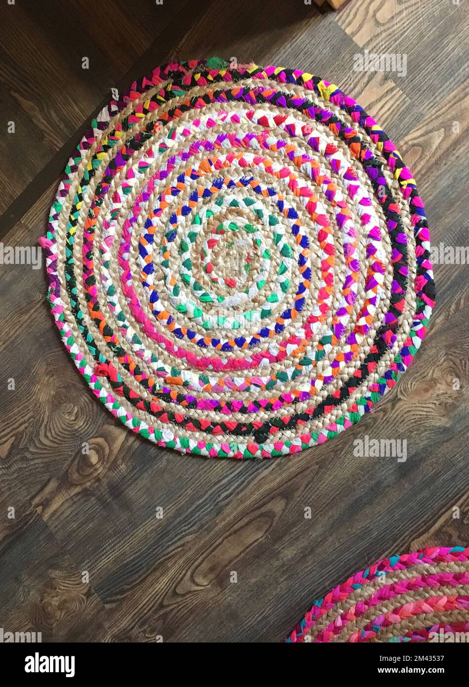 Round woven rugs made from knitted yarn and natural rope Stock Photo