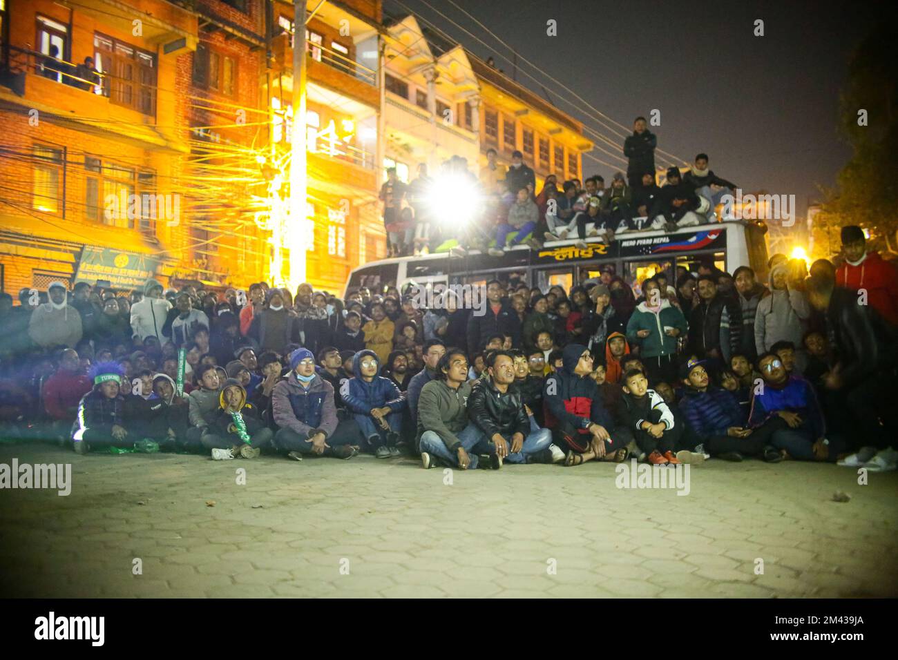 Nepal. 18th Dec, 2022. Nepali football fans watch the final match of
