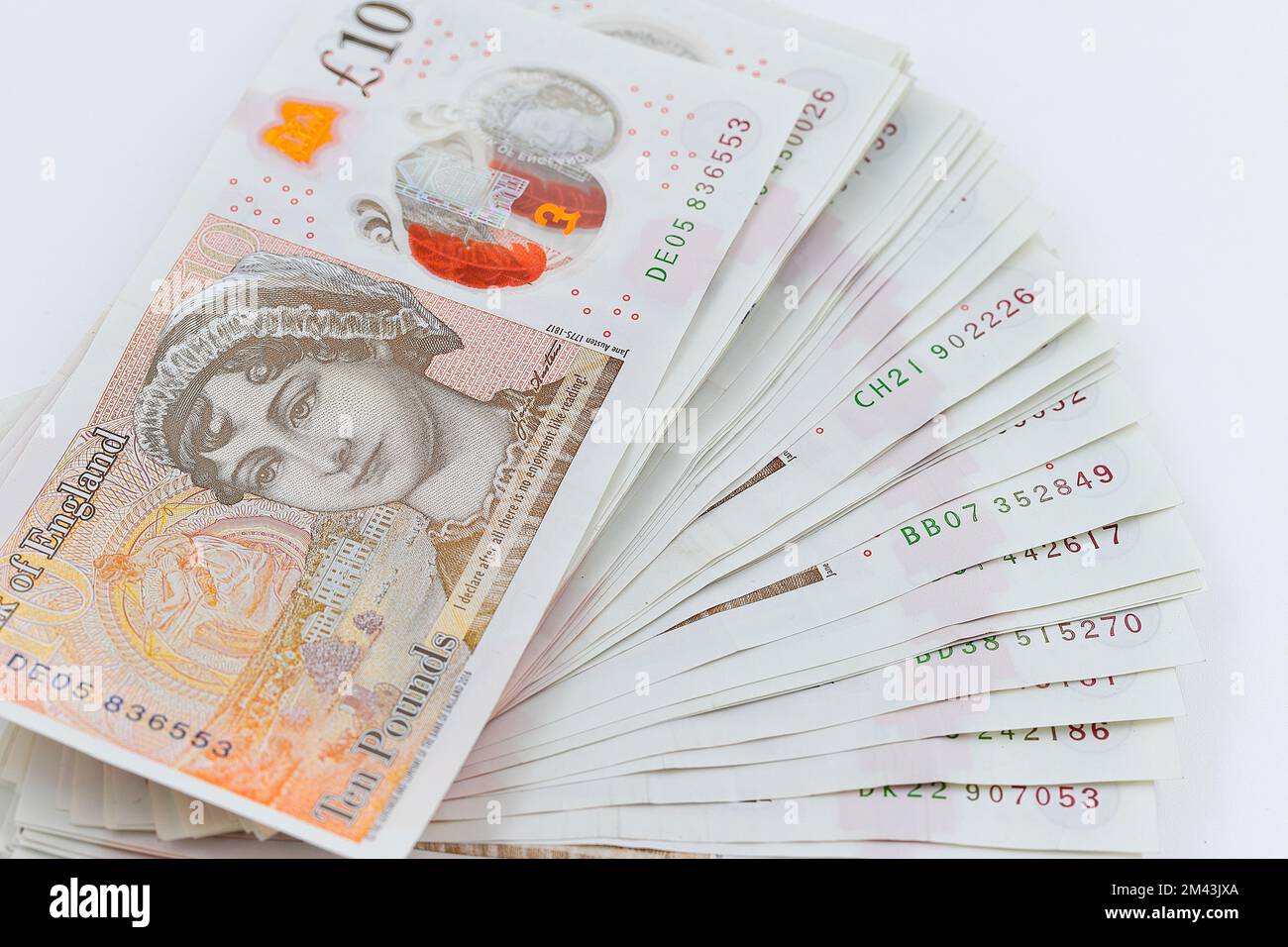 A pile of Bank of England polymer £10 notes showing Jane Austen on the rear Stock Photo