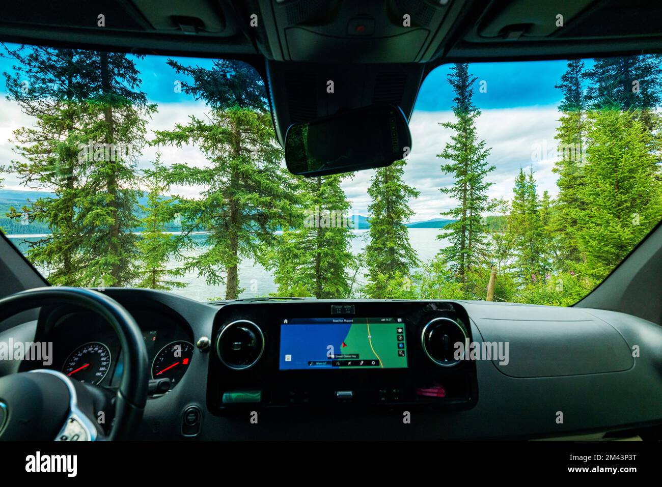 Driver's view of Dease Lake at sunset; Airstream Interstate 24X 4WD