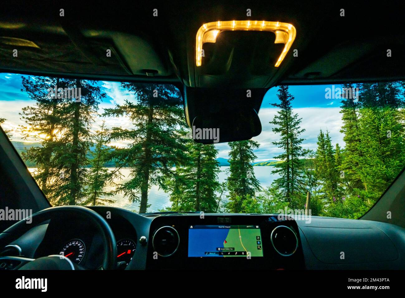 Driver's view of Dease Lake at sunset; Airstream Interstate 24X 4WD