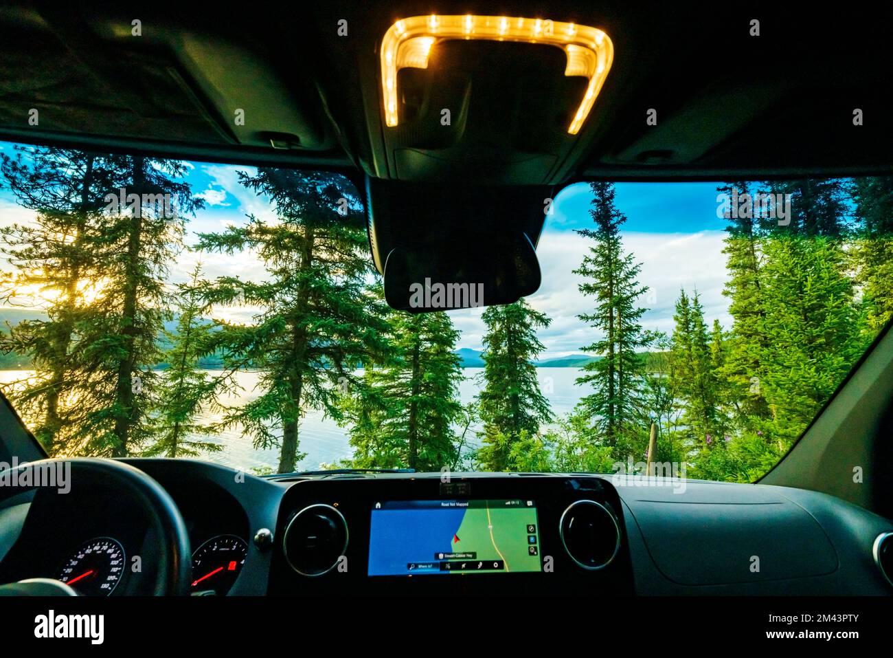 Driver's view of Dease Lake at sunset; Airstream Interstate 24X 4WD