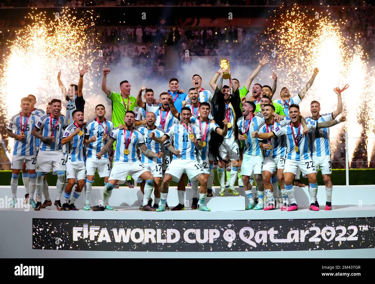 Argentina captain Lionel Messi lifts the FIFA World Cup trophy following victory over France in the FIFA World Cup Final match at the Lusail Stadium in Lusail, Qatar. Picture date: Sunday December 18, 2022. Stock Photo