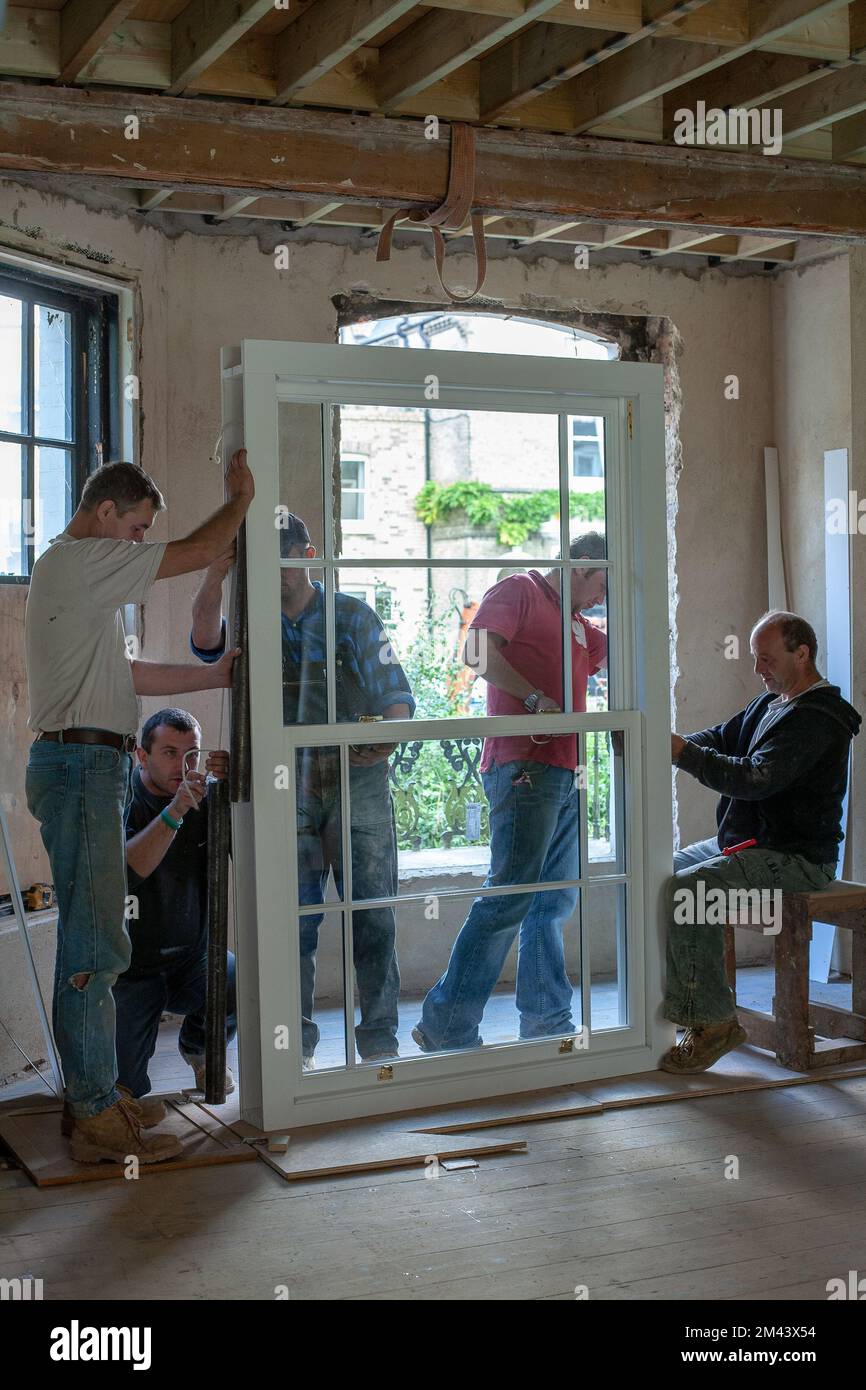 Workers are installing a window Stock Photo