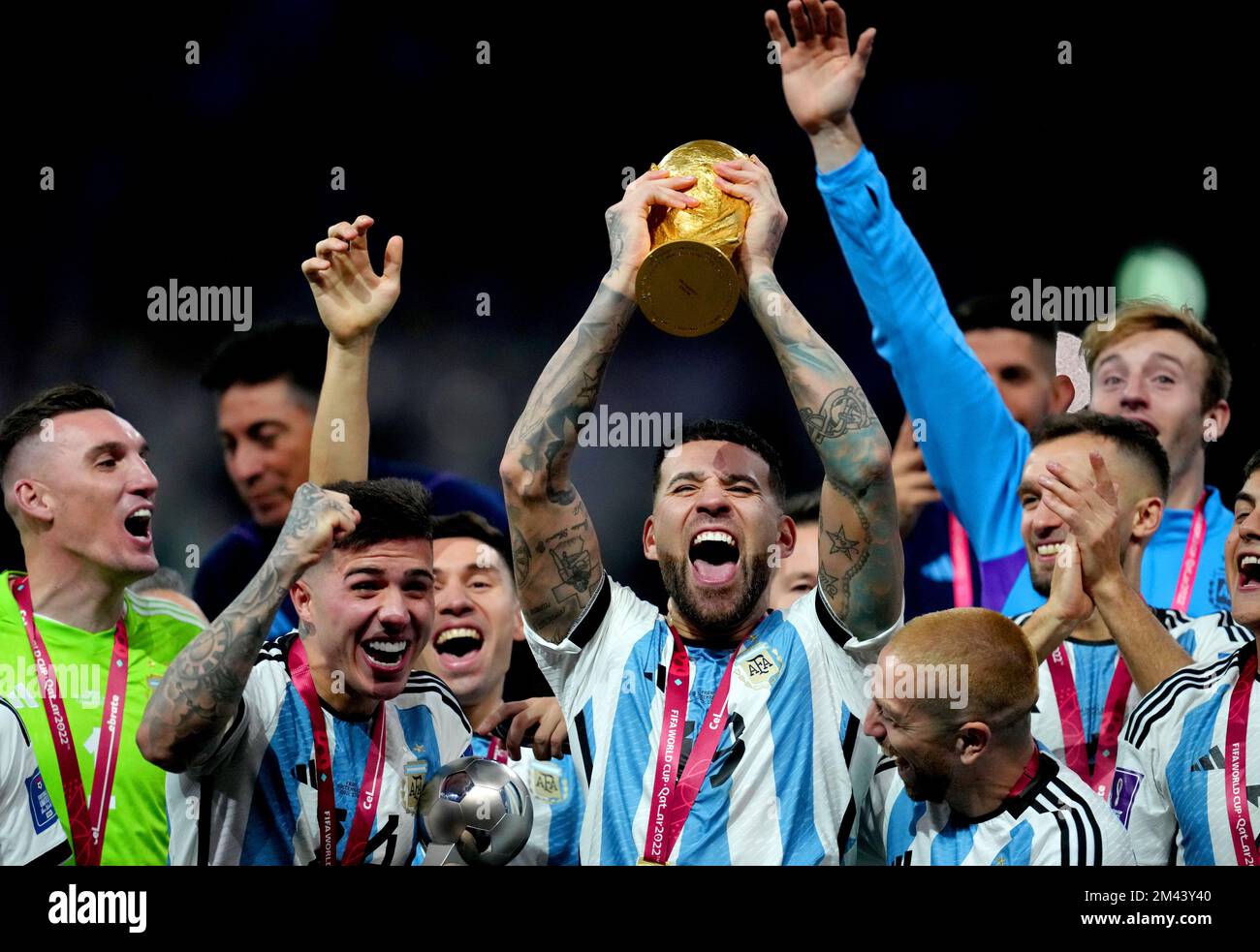 Argentina's Nicolas Otamendi celebrates with the FIFA World Cup trophy after winning the FIFA World Cup final at Lusail Stadium, Qatar. Picture date: Sunday December 18, 2022. Stock Photo